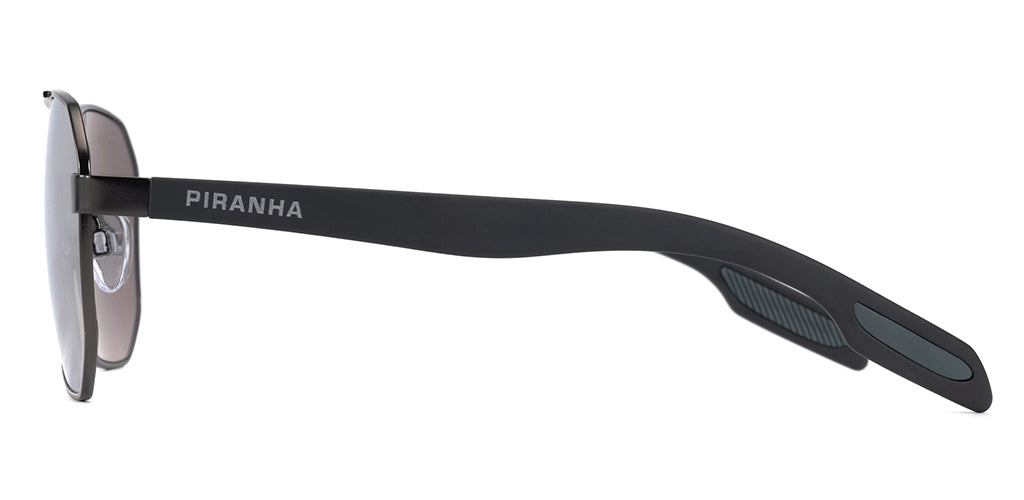 Left side facing view of angular aviator sunglasses frame with smoky gray tinted lenses, lightweight metal construction, and a smooth gray metal finish on a white background. Wide plastic temples with rubber touch ear tips for a comfortable, secure fit. PIRANHA logo in san serif font printed on temple.