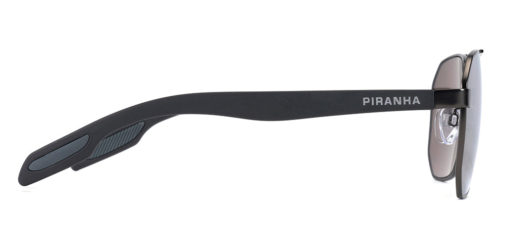 Right side facing view of angular aviator sunglasses frame with smoky gray tinted lenses, lightweight metal construction, and a smooth gray metal finish on a white background. Wide plastic temples with rubber touch ear tips for a comfortable, secure fit. PIRANHA logo in san serif font printed on temple.